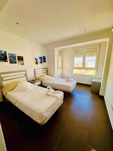 En eller flere senge i et værelse på Caminos del Mediterráneo