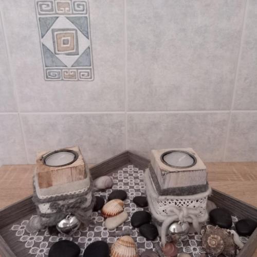a bathroom with two toilets and shells on a table at Residence Wiesenheim in Trodena