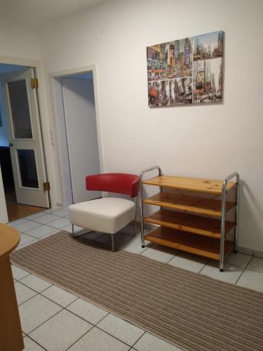 a living room with a bench and a chair at Apartment Fasching in Deutsch Goritz