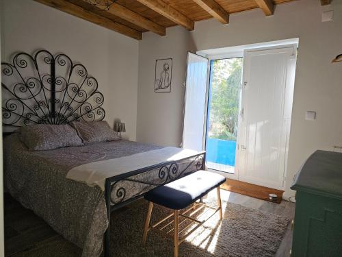 Ένα ή περισσότερα κρεβάτια σε δωμάτιο στο Cantinho da paz Peacefull Haven