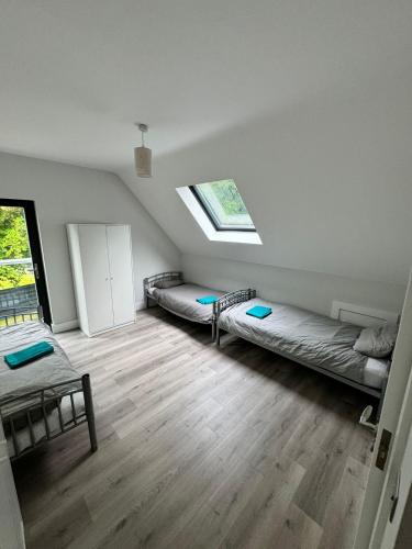 a room with two bunk beds and a window at Gorey Private Lodging & Holiday Mansion in Hollyfort