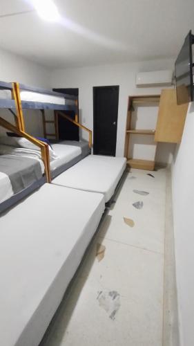 Una cama o camas en una habitación de Hotel Tranvia