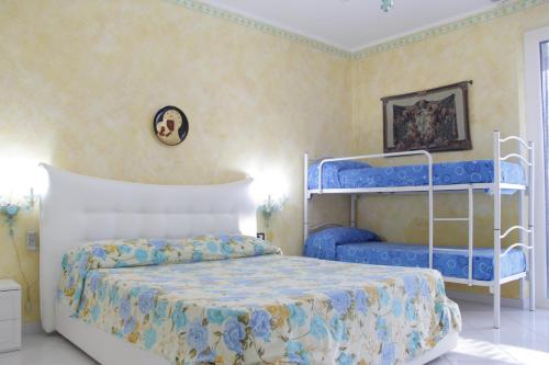 Ένα ή περισσότερα κρεβάτια σε δωμάτιο στο Villa Grignoli