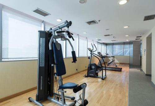 a gym with several treadmills and exercise machines at LCB Hotel Fuenlabrada in Fuenlabrada