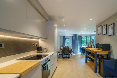 a kitchen with a counter and a dining room at The Smelting Pot in Backbarrow