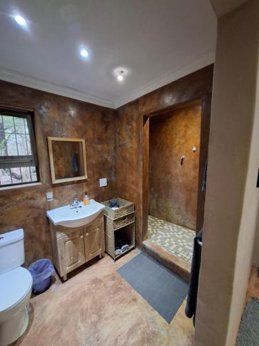 Koupelna v ubytování Rhino Cottage