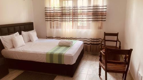 Postel nebo postele na pokoji v ubytování Elysian home villa