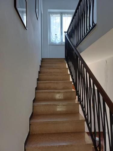 a staircase in a home with a stair railing at Casa Mariuccia in Ponzone