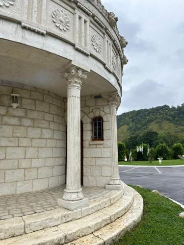 a stone building with a window on the side of it at Domaine Athéna in Pitres