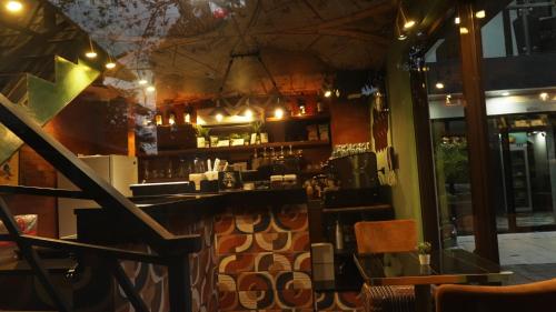 a bar in a restaurant with a counter at BAIA Laiya Marienella Resort in San Juan
