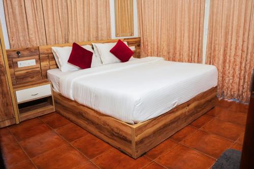 Postel nebo postele na pokoji v ubytování Lakkidi Mist Resort