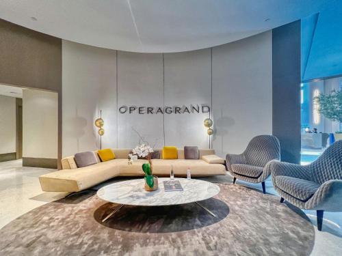 a living room with a couch and a table at Luxury 2BR Apartment with Stunning Burj Khalifa & Fountain Views - Opera Grand, Downtown in Dubai