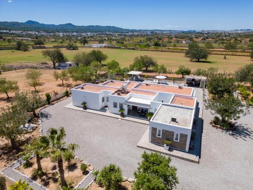 an overhead view of a white house with a yard at Villa in San Antonio sleeps 10 in Ses Paisses