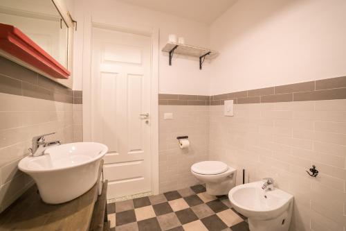 a bathroom with a sink and a toilet at The Foria House by House In Naples in Naples