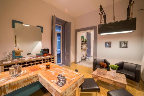 a living room with a table and chairs at The Foria House by House In Naples in Naples