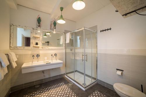 a bathroom with a shower and a sink and a toilet at The Foria House by House In Naples in Naples