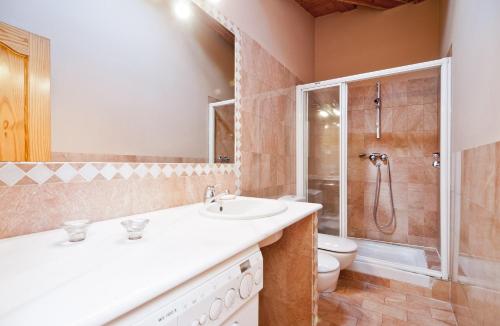 a bathroom with a sink and a toilet and a shower at Puerta del Sol VI in Madrid