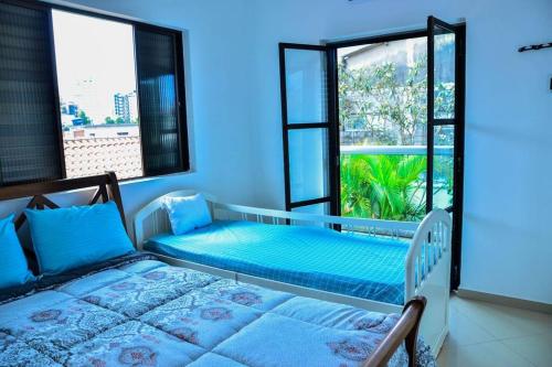 Postel nebo postele na pokoji v ubytování Casa alto padrão com vista espetacular para praia