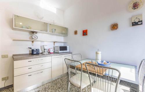 a kitchen with a table and chairs in a room at Villa Marisa in Monteverdi Marittimo
