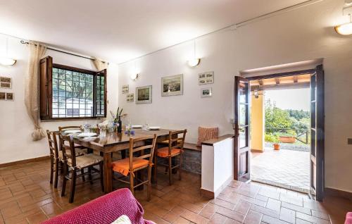 a dining room with a table and chairs at Villa Marisa in Monteverdi Marittimo
