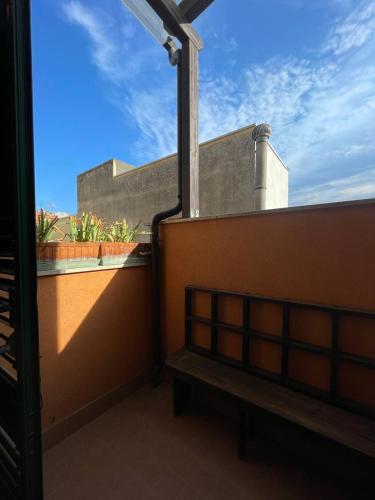 a view of a balcony with a bench on a building at B&B Anna in Montescaglioso