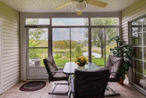 a dining room with a table and chairs and a large window at Daydreamer - Beautiful Views & Location in Branson