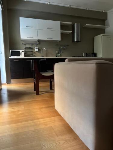 a kitchen with a table and a counter top at Acquedotto the house in Rome