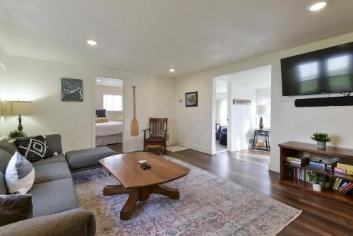 a living room with a couch and a coffee table at Laketown Cottages Blue Anchor in Rockaway Beach
