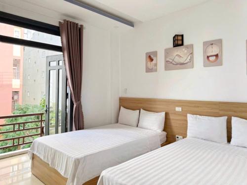 Postel nebo postele na pokoji v ubytování Thanh Hiền HB Hotel