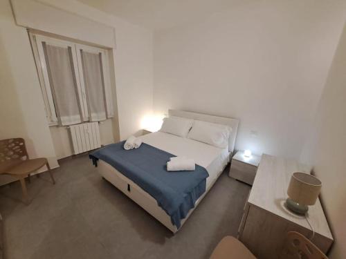 Ένα ή περισσότερα κρεβάτια σε δωμάτιο στο Risorgimento Apartment Verona