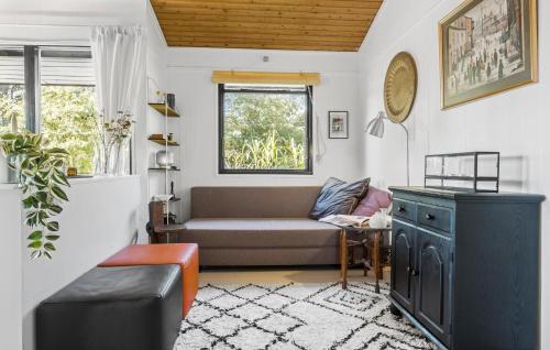 a living room with a couch and a window at 3 Bedroom Lovely Home In Eskebjerg in Eskebjerg