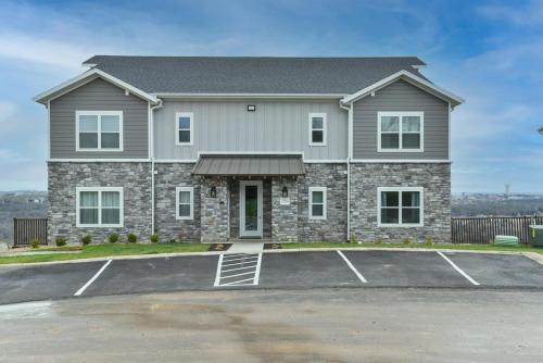 a large house with a parking lot at Mystic Cove Condo - Pool - Perfect location in Branson