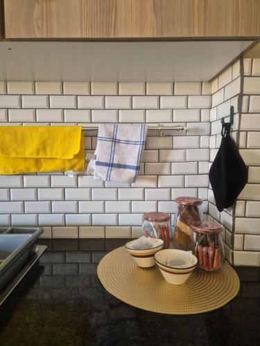 a table with three bowls on it in a kitchen at Jakkalswater guest farm in Nababeep