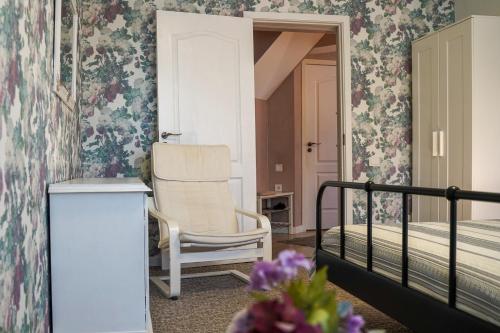 Postel nebo postele na pokoji v ubytování Apartamentai Birštono centre su židiniu