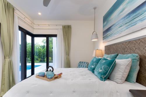 Ένα ή περισσότερα κρεβάτια σε δωμάτιο στο Villa Belle Vie #9