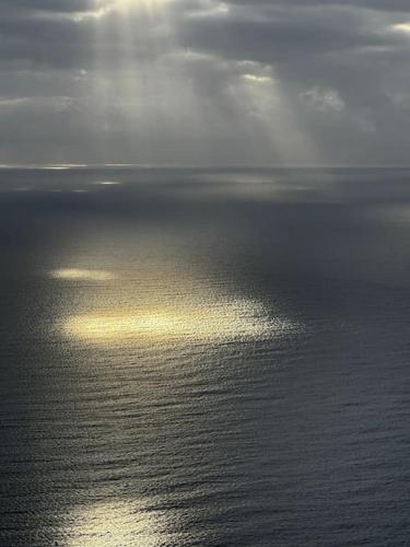an image of the ocean with the sun shining on the water at Beachfront, First line, 2-Bdr,2-Bath, Swiming Pool in Albir