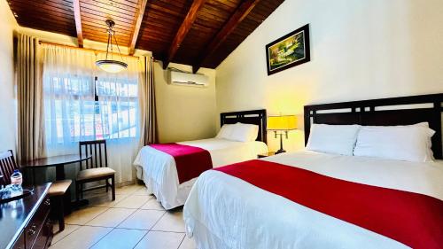 Voodi või voodid majutusasutuse Hotel Alameda toas