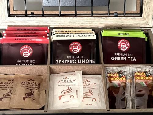 a shelf filled with different types of teazos at My tiny lovely house in Civitavecchia