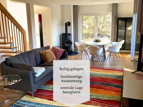 a living room with a couch and a table at Ferienhaus Kalea in Userin