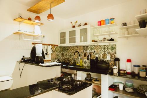 a kitchen with a stove and a counter top at Casa Bananeiras Tunel in Bananeiras