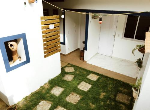 a view of a room with a green rug at Casa Bananeiras Tunel in Bananeiras