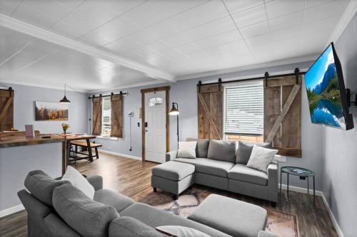 a living room with a couch and a table at Close to Hiawatha Tr and Biking with HOT TUB in Wallace
