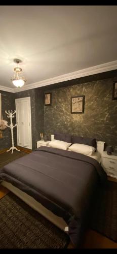 a bedroom with a large bed in a room at Nice appartement au centre de IFRANE in Ifrane