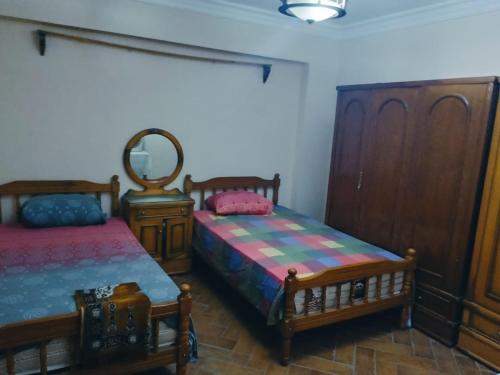 Postel nebo postele na pokoji v ubytování بأرقى مكان على شاطىء الاسكندرية
