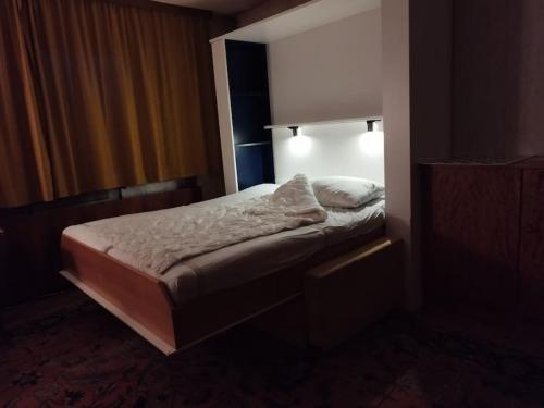 a bedroom with a bed with a light on it at 100qm - Räumlichkeiten, Bregenz am Bodensee in Bregenz