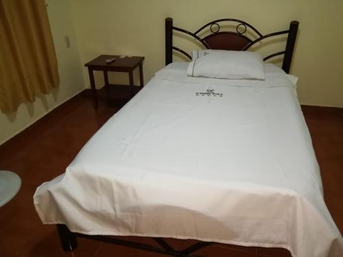 Katil atau katil-katil dalam bilik di Hotel el CRISTAL Muzo