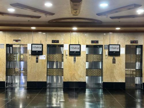 a row of lockers in a building at Nomad Partition Room in Barsha Heights 3 mins to ICM Metro in Dubai