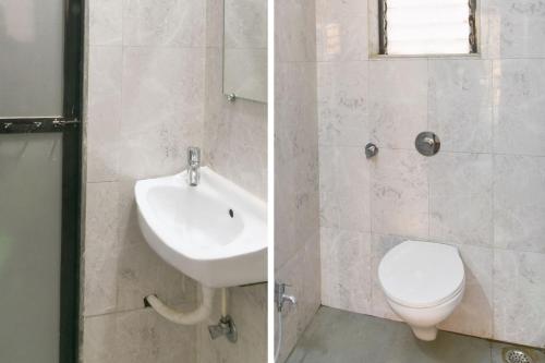 a bathroom with a sink and a toilet at Hotel O GEMS STAR RESIDENCY BNB Bamandongri Railway Station in Belapurpāda