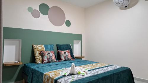 Ein Bett oder Betten in einem Zimmer der Unterkunft Résidence Paradis