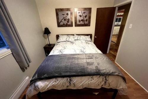 a bedroom with a bed in a room at Cozy Country Vacation Home in Scoudouc